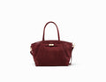 Sac à main en cuir velours bordeaux, élégant et spacieux pour femmes sophistiquées.