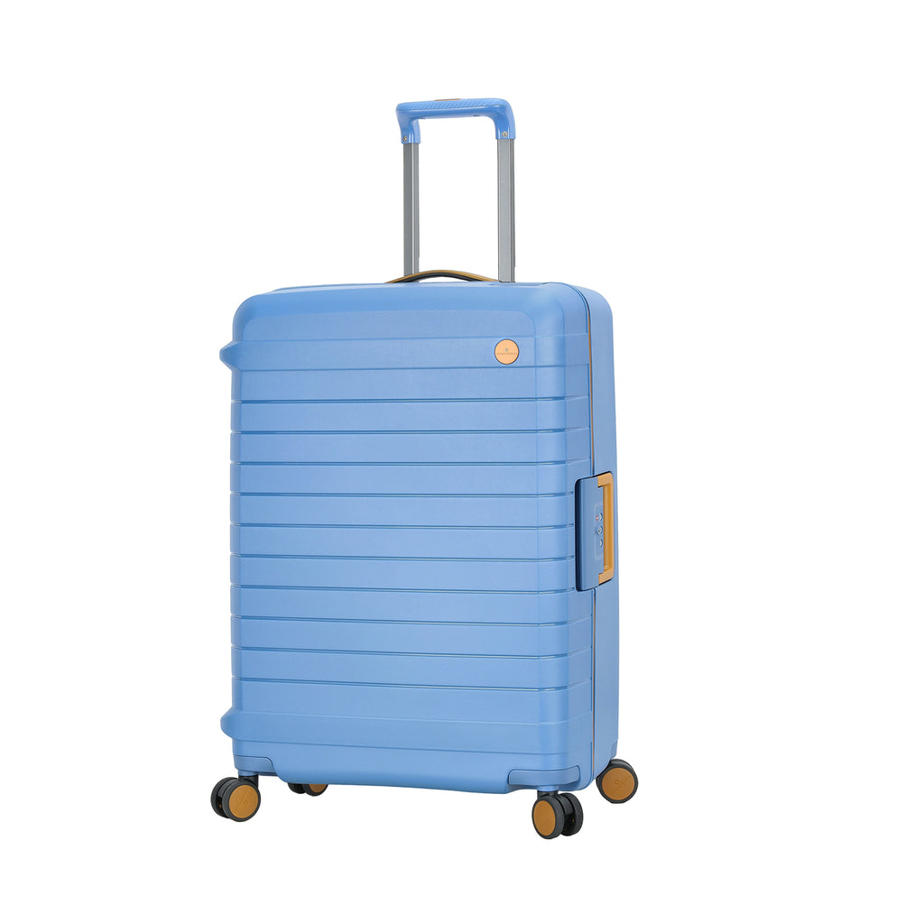 Valise cabine en polycarbonate bleu avec poignées et roulettes, idéale pour voyage.