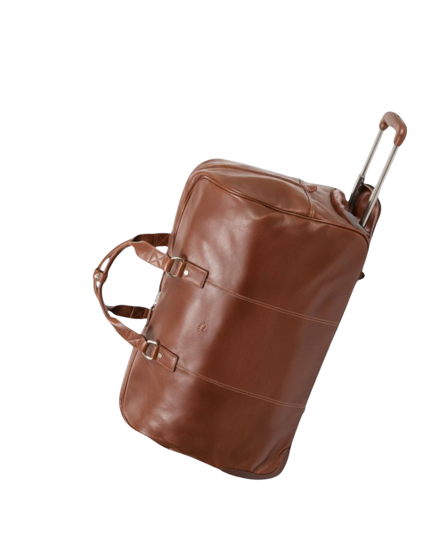 Sac de voyage en cuir marron avec poignée télescopique.