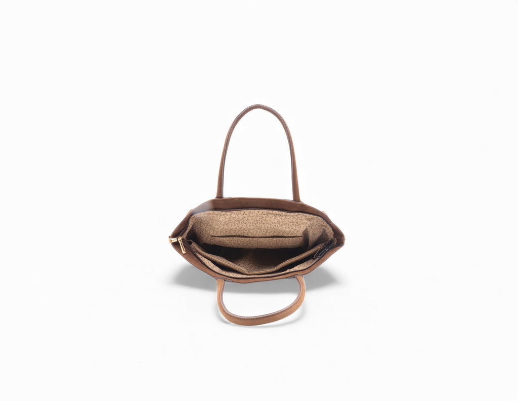 Sac à main en cuir marron avec intérieur en tissu beige à motifs.