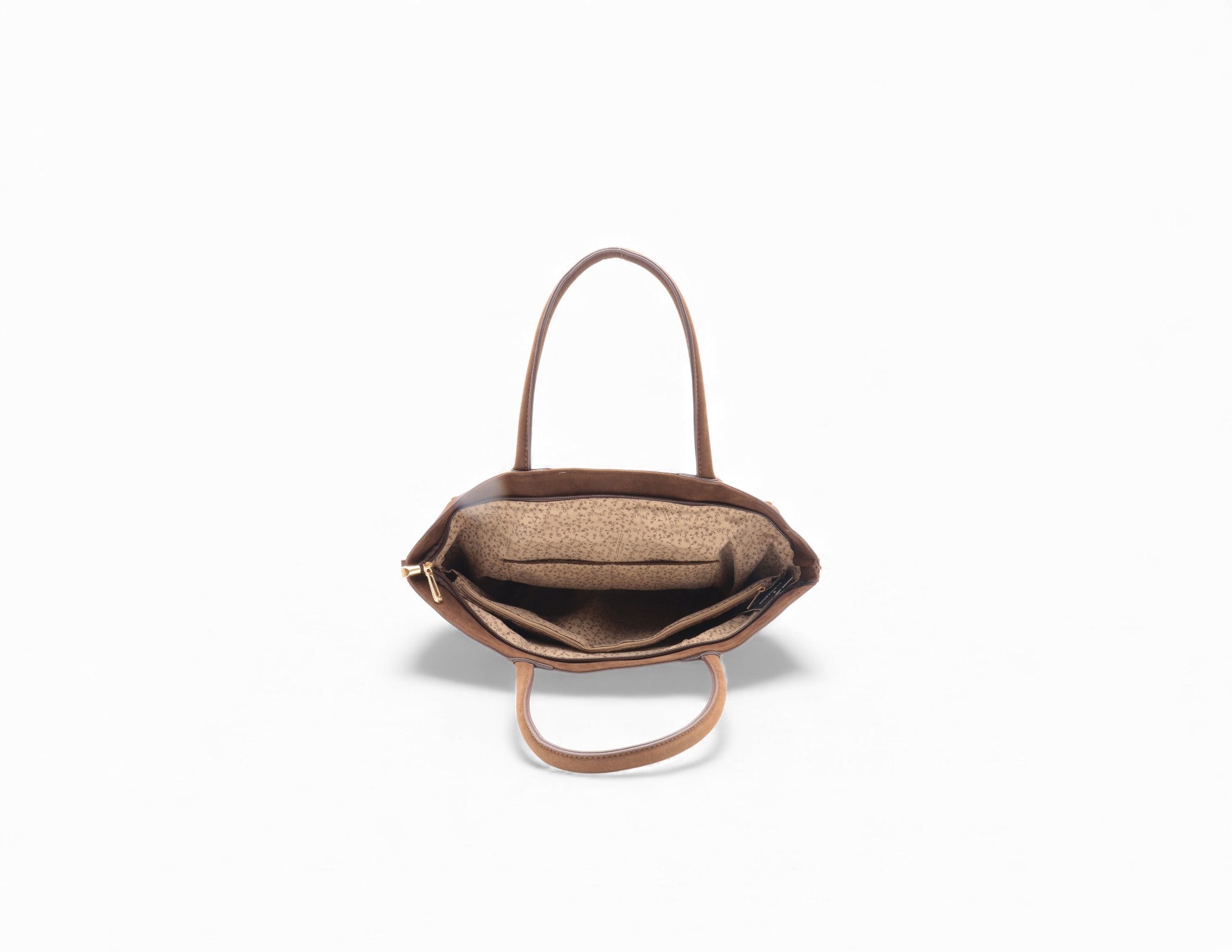 Sac à main en cuir marron avec intérieur en tissu beige à motifs.